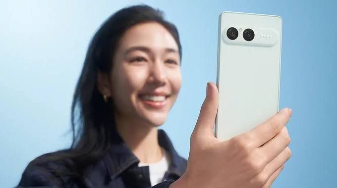 Close up of a Sony Xperia smartphone showing the side profile with a physical power button and camera shutter key.