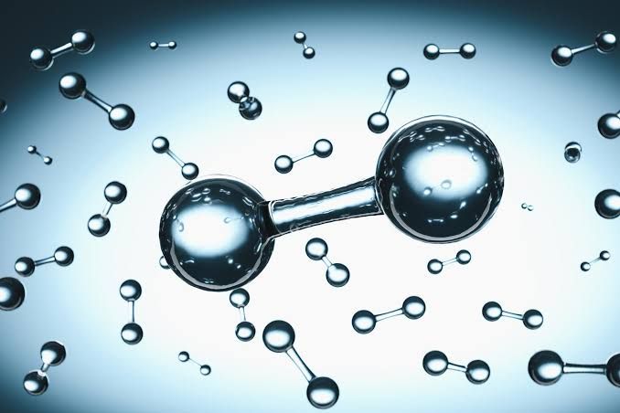 Close-up render showing H2 hydrogen molecules interacting with a vanadium crystal lattice structure.