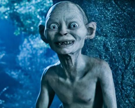 Andy Serkis as Gollum, a pale creature in a rocky, blue-lit landscape from The Lord of the Rings.