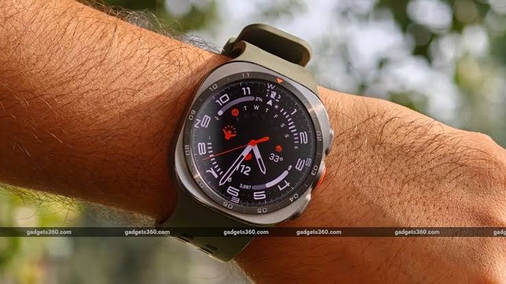 Samsung Galaxy Watch Ultra 2 displayed with its titanium casing and green strap on a wrist.