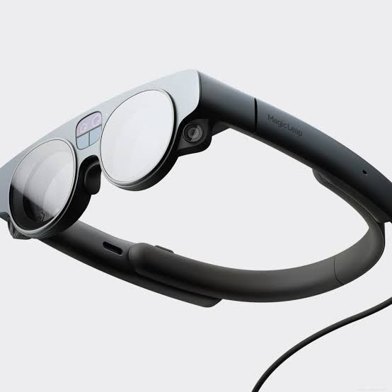 The Magic Leap 2 augmented reality headset resting on a white surface.