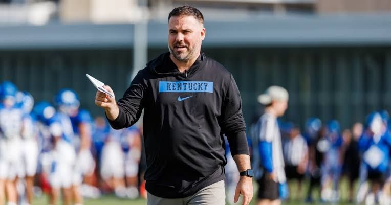 Pat Biondo, former general manager of the Kentucky football team, standing on the field during his tenure.