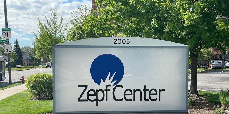 Zepf Center staff providing housing and employment resources to residents as part of the HOPE outreach program.