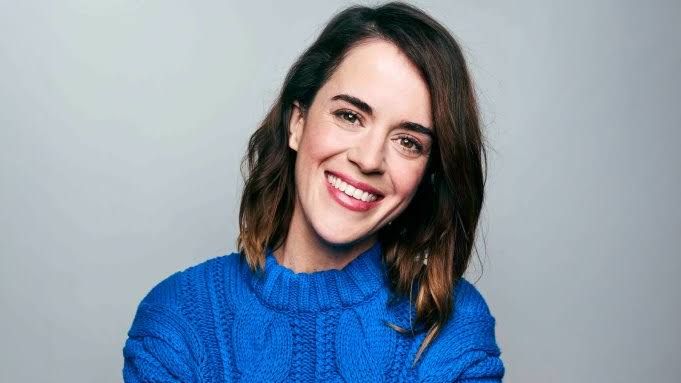 Actress Mary Holland poses for a professional headshot.