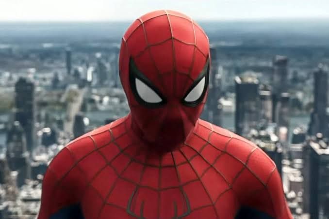 Tom Holland as Spider-Man wearing his suit while looking out over a city landscape in Brand New Day.