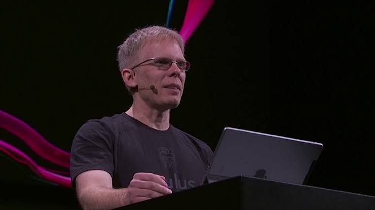 John Carmack speaking at an industry event regarding virtual reality platform development and legacy game software.