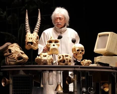 Tatsuya Fujiwara and Miu Tomita performing on stage in the theatrical adaptation of Murakami's Hard-Boiled Wonderland.