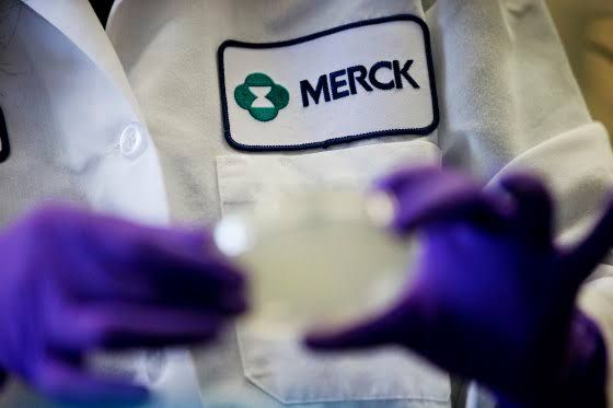 A Merck scientist works in a laboratory setting conducting research on cardiovascular medication development.