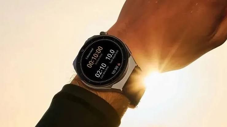 Close-up of a smartwatch display showing health tracking data during a product presentation.