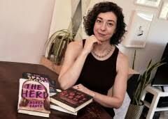 Thriller novelist Andrea Bartz sitting in her home office, representative of the authors involved in the Anthropic settlement.