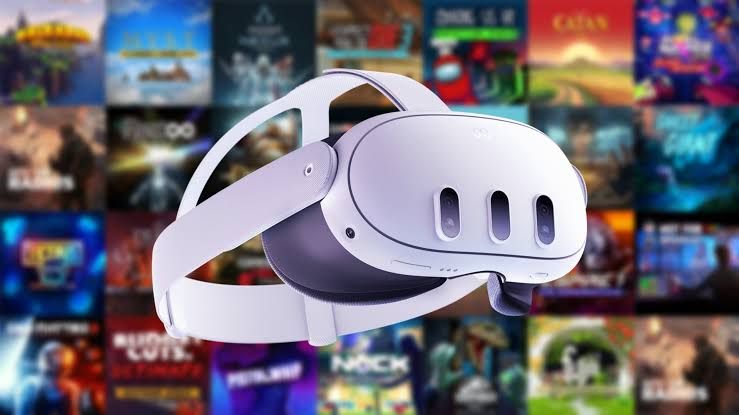 Meta Quest 3 headset resting on a desk with a blurred monitor showing VR game performance data in the background.