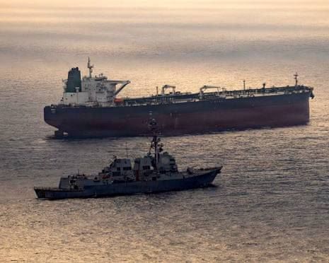 The USS Rafael Peralta conducting a maritime blockade of the Iranian oil tanker Herby during recent regional operations.