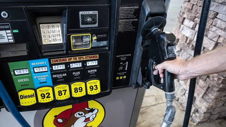 A person pumping gasoline at a station in Texas as prices hit record levels during the 2026 Labor Day weekend.