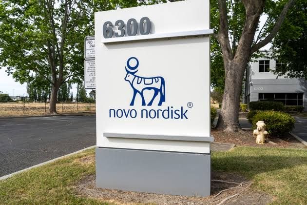 A clinical close-up of a Novo Nordisk Wegovy pen next to a blister pack of oral weight management medication.