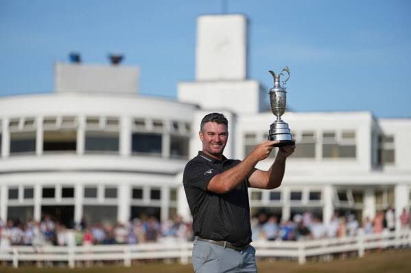 Ryan Fox of New Zealand holds the Claret Jug trophy at Royal Birkdale after winning the 2026 British Open.