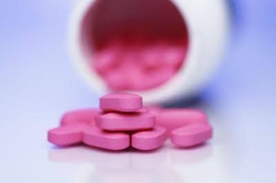 A standard bottle of Benadryl antihistamine tablets sits on a shelf to represent medication safety warnings.