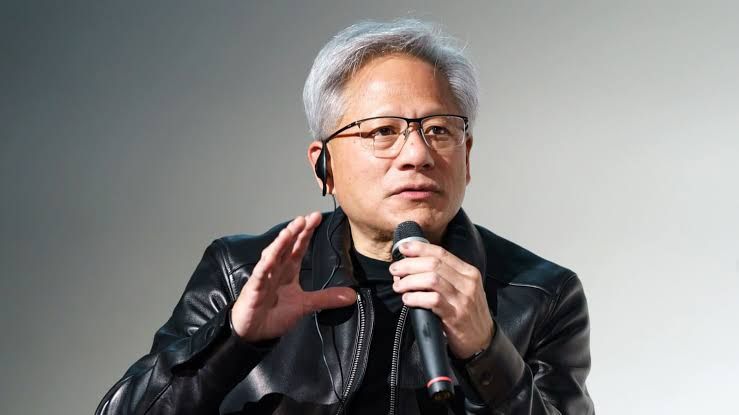 Nvidia CEO Jensen Huang at a 2026 Tokyo press conference regarding physical AI and robotics platform collaborations.