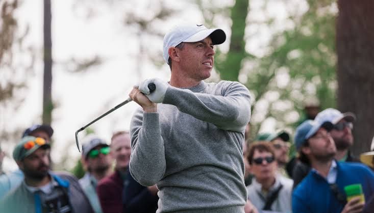 Bryson DeChambeau walking across a golf course fairway during the 2026 Open Championship at Royal Birkdale.