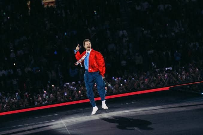 Harry Styles performing on stage during the Together, Together Tour in Amsterdam in May 2026.