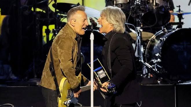 Jon Bon Jovi and Bruce Springsteen standing together at the MusiCares Person of the Year Gala in Los Angeles.