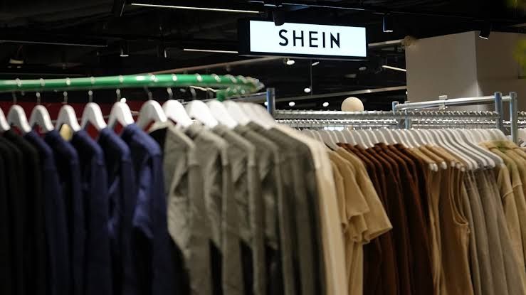 Clothes displayed at a Shein store in Paris, representing the brand's retail presence amid financial scrutiny.