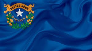 The Nevada state flag flying in front of a government building, representing the public retirement system.