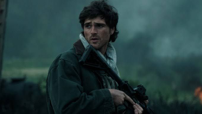 Jacob Elordi as a pilot named Hig standing near his yellow Cessna plane in a desolate landscape for The Dog Stars.