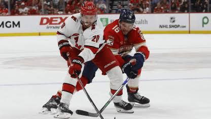 Sebastian Aho and Aleksander Barkov posing in professional hockey jerseys for the 2027 NHL All-Star promotional materials.