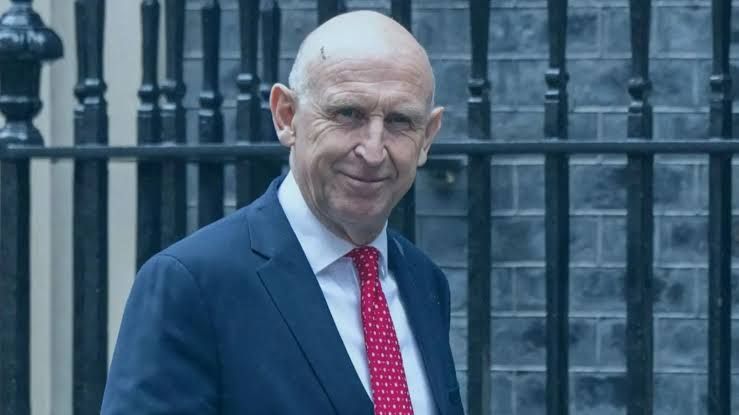 Chancellor John Healey walking away from Number 11 Downing Street while discussing the new regional growth fund.