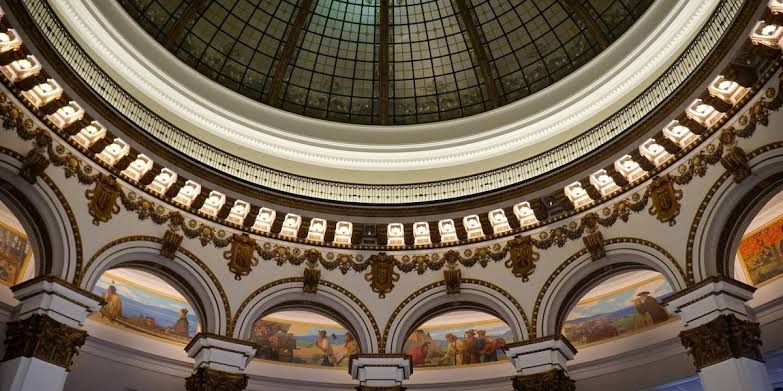 Thirteen murals by Francis Davis Millet circle the high domed rotunda of the historic Cleveland Trust Company building.