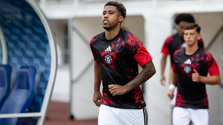 Andrey Santos wearing the Manchester United kit during his debut match at the Olympic Stadium in Helsinki.