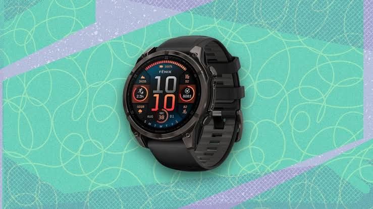 Garmin Fēnix 8 smartwatch with a titanium case and gray band displayed against a white background.