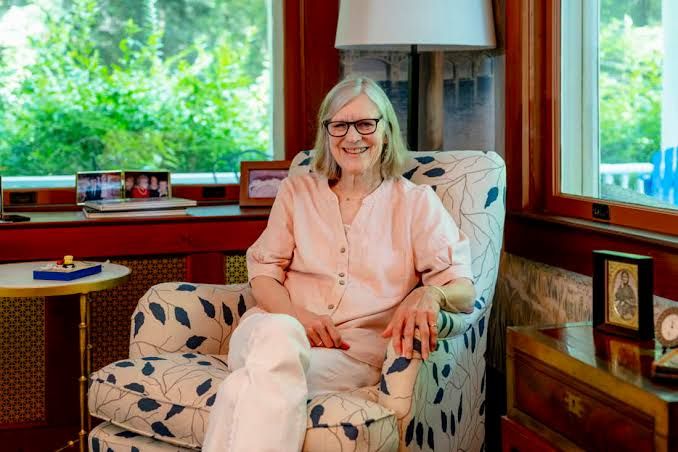 Author Ann M. Martin poses in her home office surrounded by various editions of her book series.