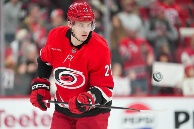 Alexander Nikishin during a game, representing his defensive presence on the ice for the Carolina Hurricanes.