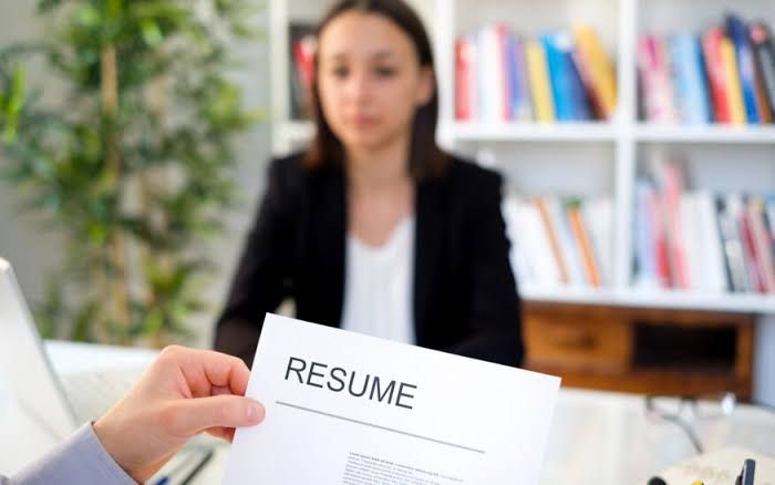 A professional desk setting representing the intersection of personality and technical skill in modern recruitment.