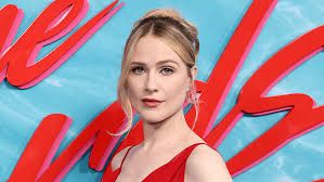 Evan Rachel Wood smiling at a formal event while discussing the casting decisions for the upcoming sequel.
