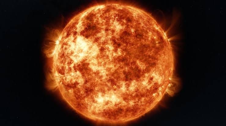 Artist representation of a star consuming a rocky planet, showing debris and glowing gases in deep space.