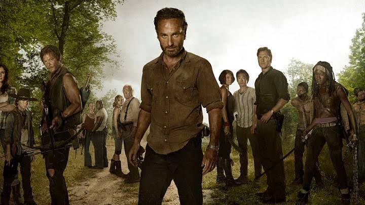 Beth Greene and Maggie Greene stand together in a scene from The Walking Dead season four.