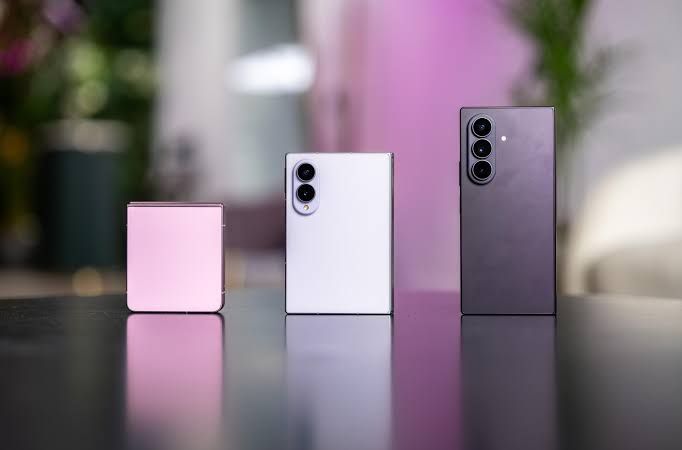 Samsung Galaxy Z Flip 8, Z Fold 8, and Z Fold 8 Ultra displayed on a table at the 2026 Galaxy Unpacked launch event.