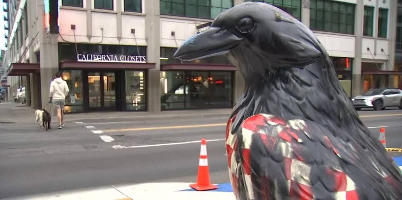 The Paul Birdyan crow statue at Southwest 13th Avenue and Burnside covered in black spray paint.