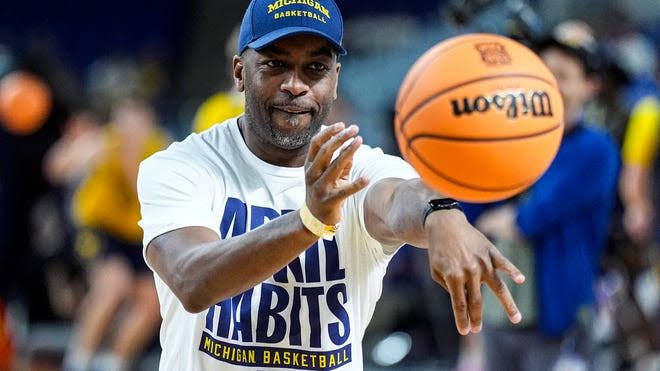 Michigan basketball coach Mike Boynton Jr. coaching on the court during a Big Ten tournament game.