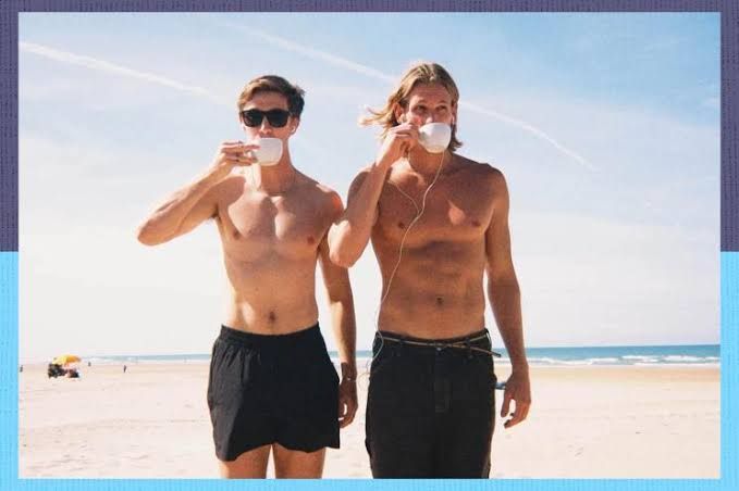 Jai Howitt and Evan Bryce pose together outdoors, representing the founders of the Art of Mondays community.
