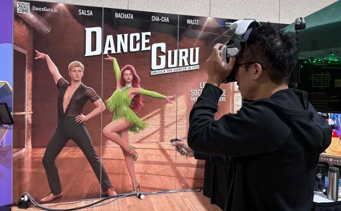 Entrepreneur David Huang demonstrates the Dance Guru VR app at the Augmented World Expo in Long Beach.