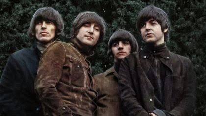 A vintage portrait of The Beatles from the 1965 era, used to promote the Rubber Soul special edition reissue.