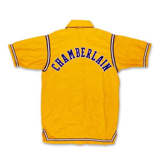 A vintage yellow Los Angeles Lakers warmup jacket worn by Wilt Chamberlain during the 1972 NBA Finals.
