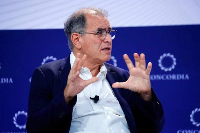 Economist Nouriel Roubini speaking at an event, discussing the current economic outlook and global market risks.