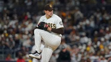 Mason Miller in a baseball uniform standing on the mound during a game.