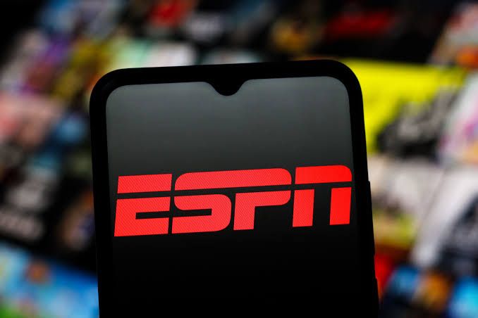 An ESPN-branded streaming interface displayed on a smartphone and a smart television showing live game footage.