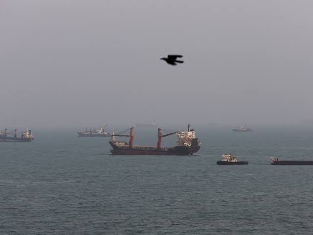 An ADNOC oil tanker navigating the Strait of Hormuz under clear skies during a period of high regional maritime tension.