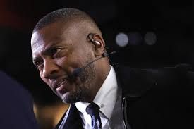 NFL analyst Ryan Clark sitting at a broadcast desk during a studio segment for an NFL program.